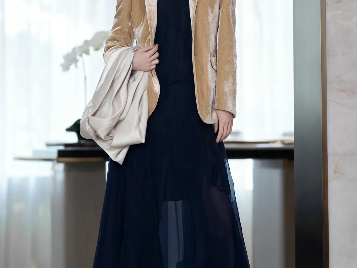 Alvin's Club — a navy chiffon dress, champagne velvet blazer, metallic shoes, and folded satin shawl in an elegant indoor reception setting